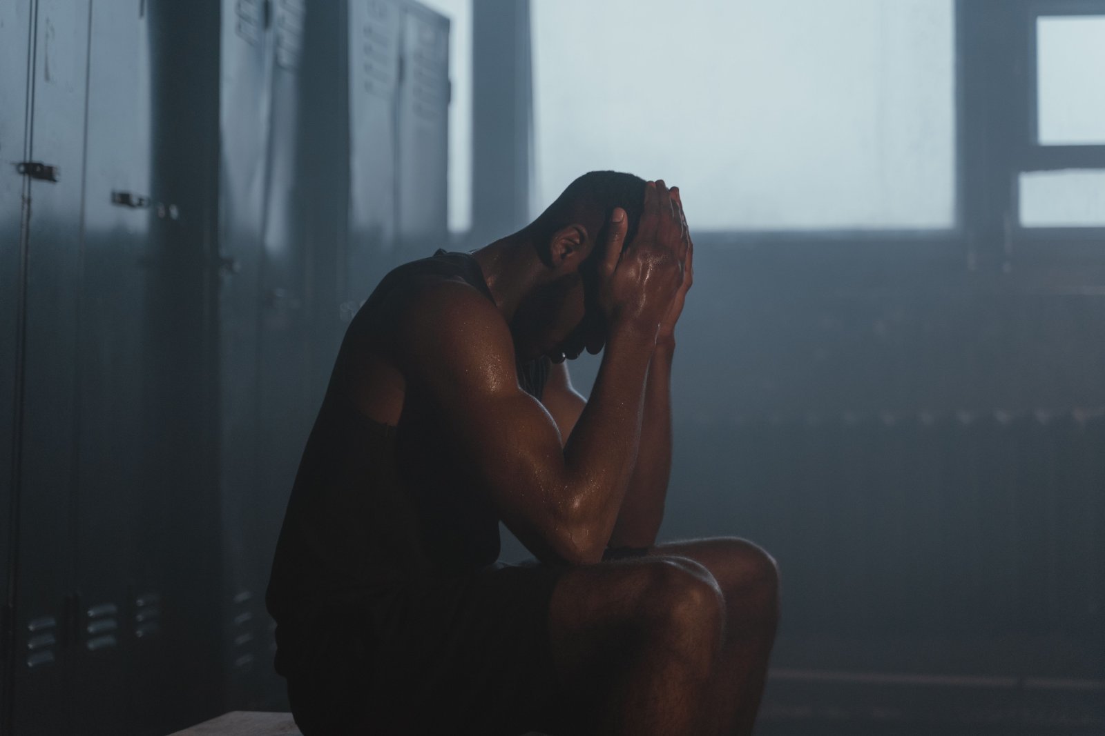 Photo of a person visibly stressed out in the gym