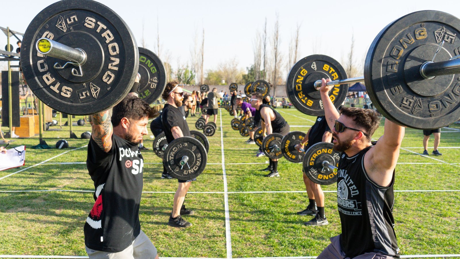 A group of men lifting heavy weights