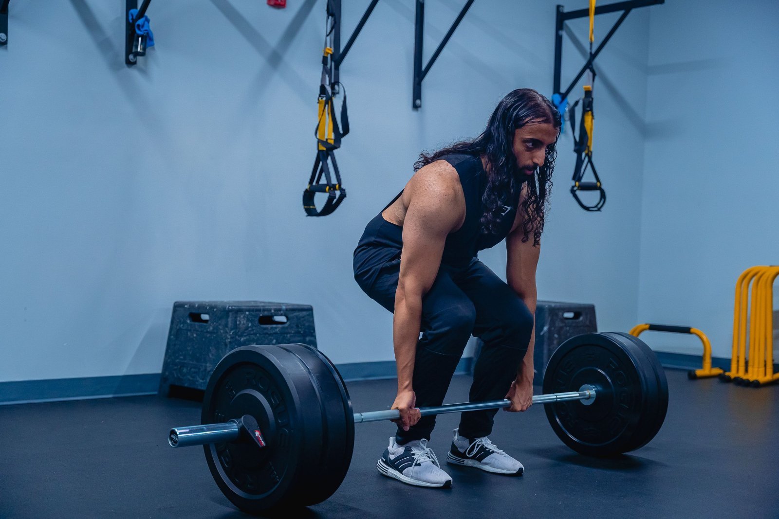 Photo of a man performing deadlifts