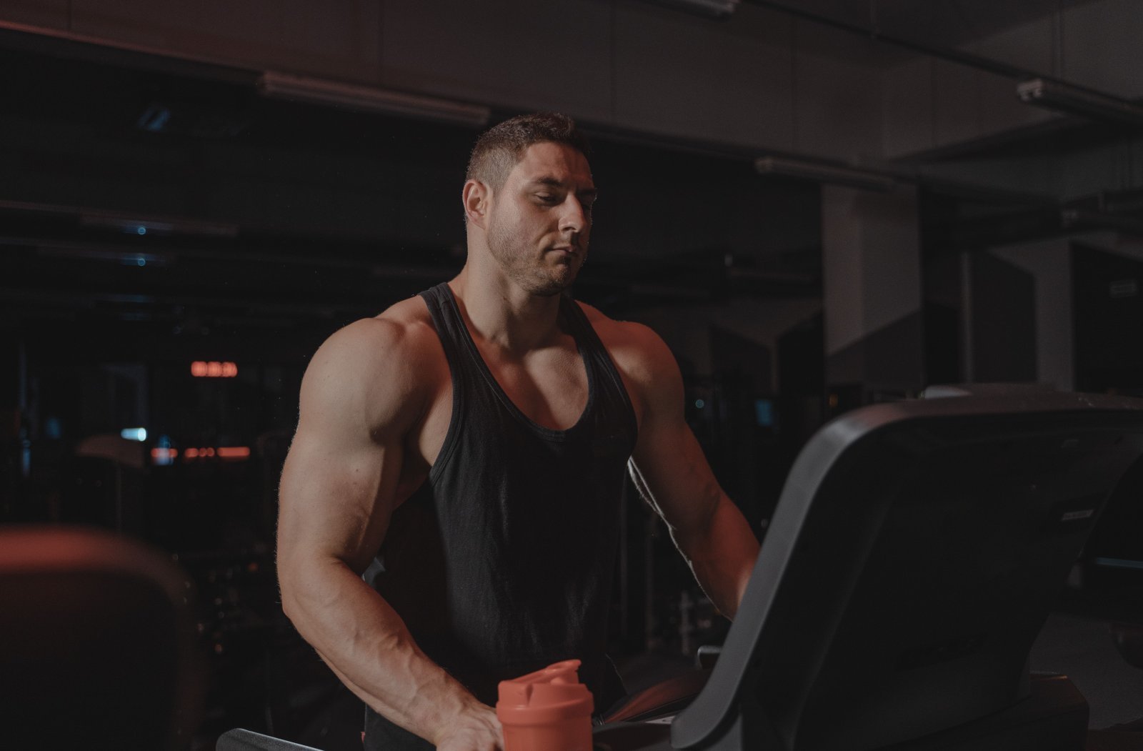 Photo of a muscular man on a treadmill