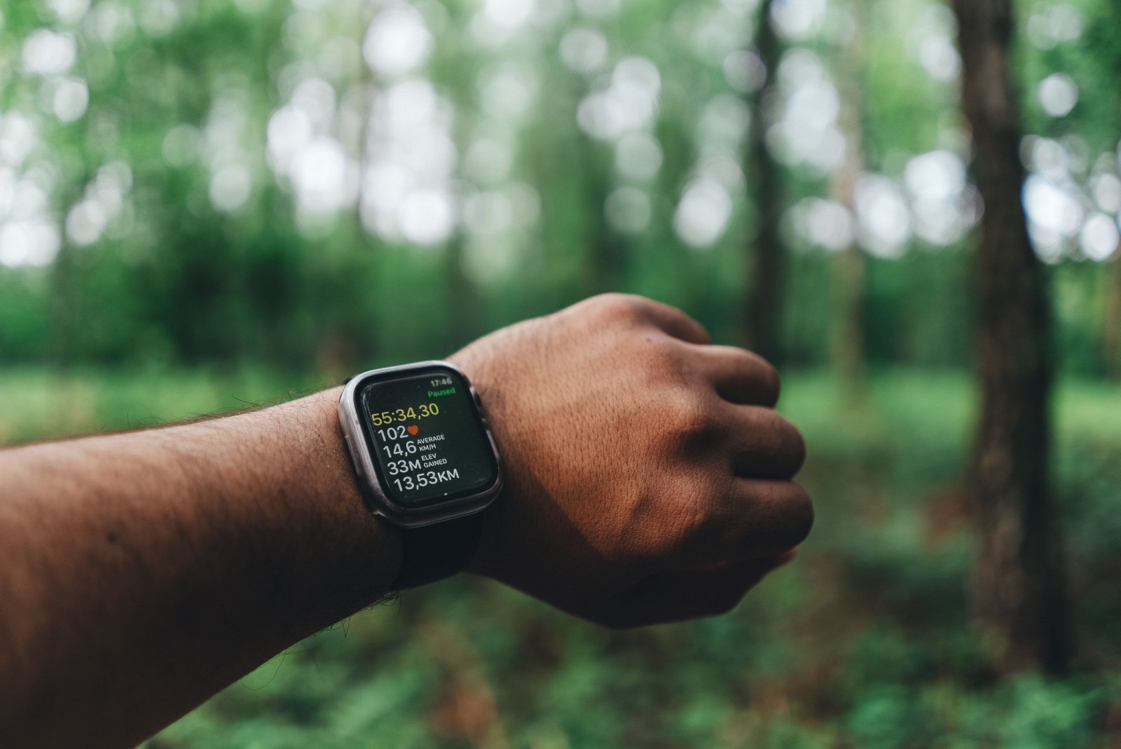 A man on a walk with a smartwatch to track his steps